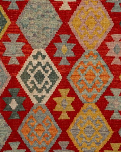Home Vibrant handmade Turkish kilim rug with geometric patterns and rich colors.